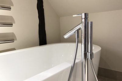 Bath with deck mounted tap