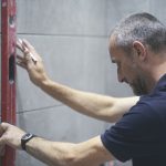 Glen holding a spirit level